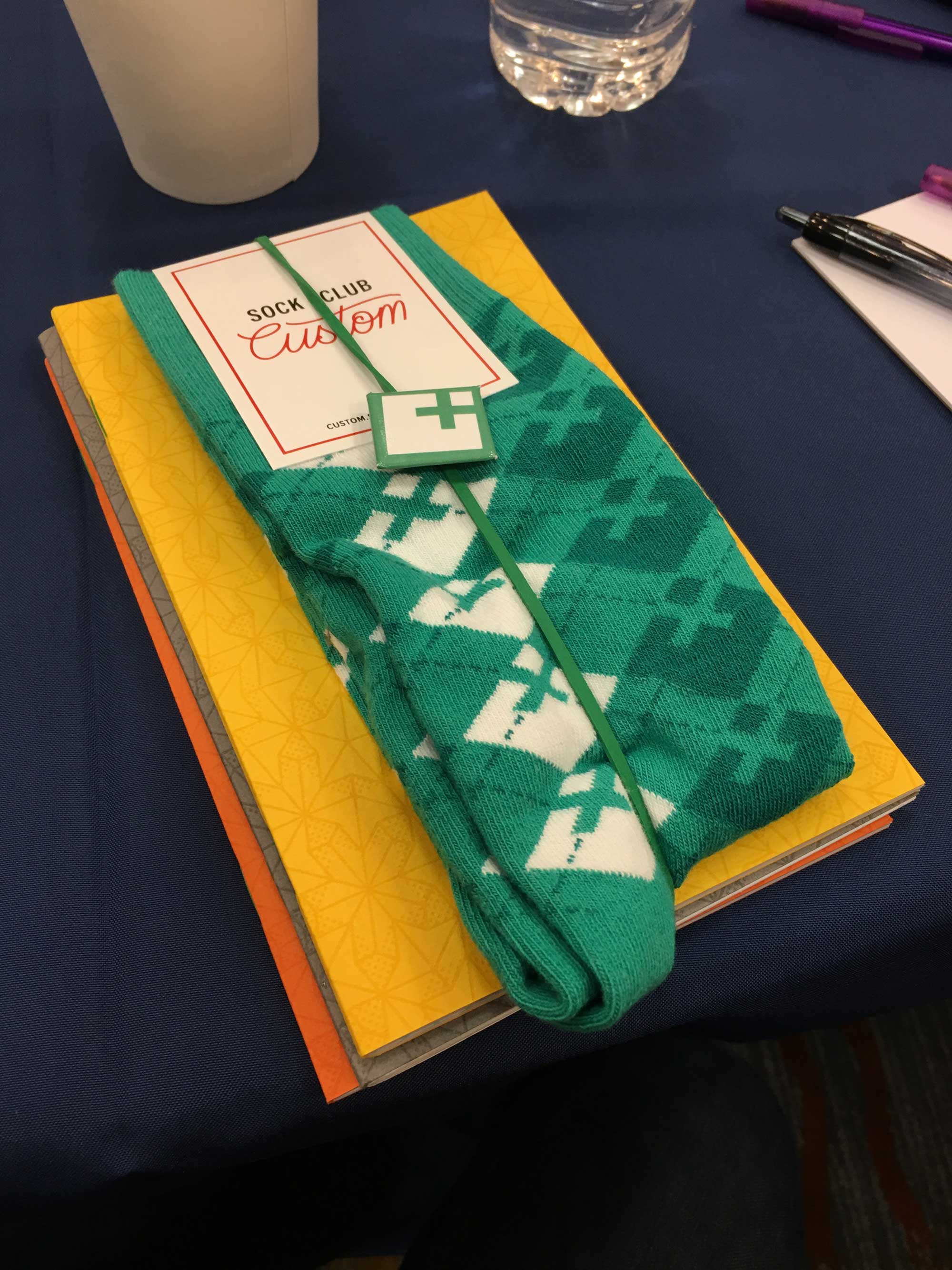 New Company swag, including notebooks and socks