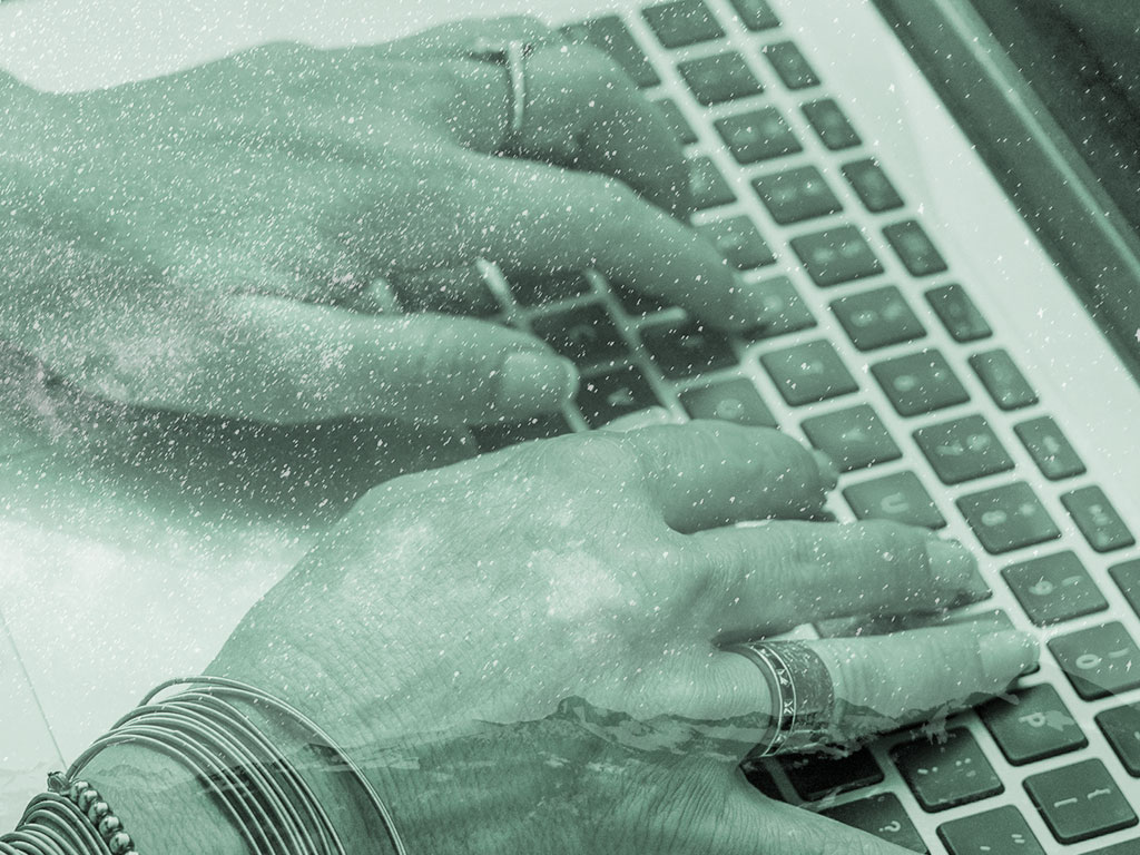 Hands typing on keyboard
